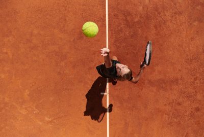 Top,View,Of,A,Professional,Female,Tennis,Player,Serves,The