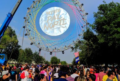 Monterrey, Mexico - April 21, 2018; Festival-goers walk under a sign for the Pa'l Norte Music Festival that is held yearly in Parque Fundidora. It is Latin America's largest music festival.